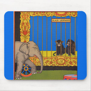 elephant strolling past the black leopards cage mouse mat