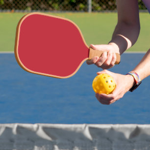 Elevate Your Design a Red Background and White Pickleball Paddle