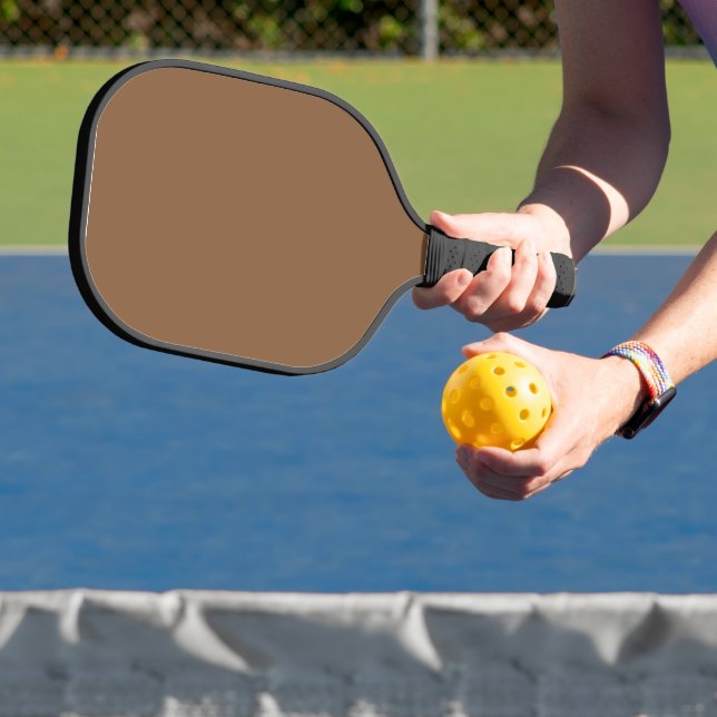 Elevate Your Design with a Brown Background Pickleball Paddle (Insitu)