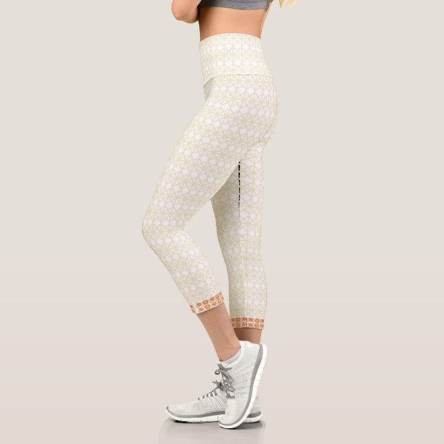 Elevate Your Space with White and Gold Geometric Capri Leggings (Left)