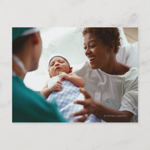 elevated close-up view of a doctor handing a new postcard