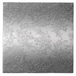 Embossed Polished Silver Roses and Tulips Tile<br><div class="desc">Elegant floral design featuring sprays of dimensional silver roses,  tulips and foliage on a glowing gradient silver background. Note:  Sculpted,  engraved,  embossed and dimensional effects,  layered,  aged or eroded appearance,  textures and shadows achieved digitally. Actual product has a smooth surface.</div>
