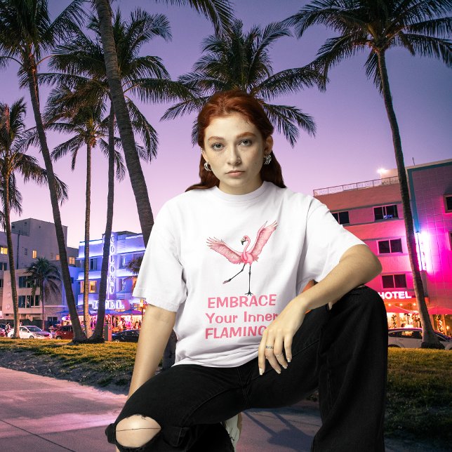 Embrace Your Inner Flamingo Funny T-Shirt (cool looking young woman wearing embrace your inner flamingo tee on neon lit Miami Florida streets)