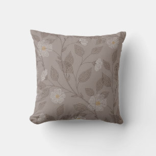 Embroidered flowers and leaves on brown background cushion
