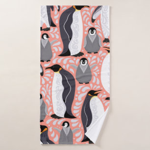 Emperor penguins and their cubs on a pink patterne bath towel