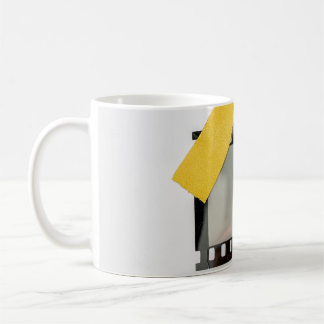 Empty 35mm film frame, yellow strips. coffee mug (Left)
