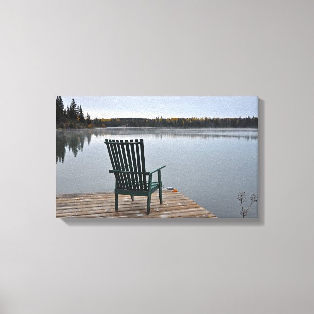 Empty chair on lake deck canvas print (Front)