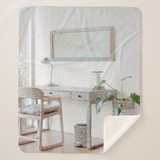 EMPTY DESK NEAR CURTAIN SHERPA BLANKET