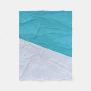 Empty gray floor beside pool fleece blanket