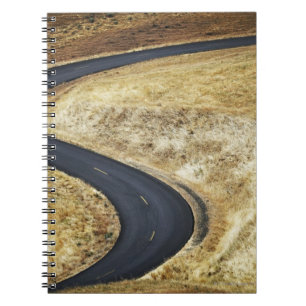 Empty winding paved road notebook