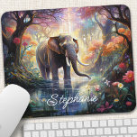 Enchanted Forest Elephant Personalised Mouse Mat<br><div class="desc">Transform your workspace into a magical sanctuary with this personalised mouse pad featuring an enchanting elephant amidst a mystical forest. The gentle giant, adorned with intricate details and surrounded by vibrant flora, creates a captivating scene, inspiring creativity and wonder. Make it truly yours by adding your name or a special...</div>