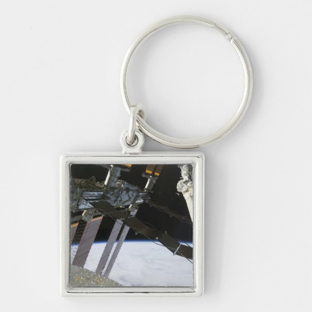Endeavour's arm amidst International Space Stat Key Ring (Front)