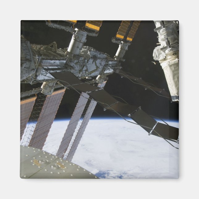 Endeavour's arm amidst International Space Stat Magnet (Front)