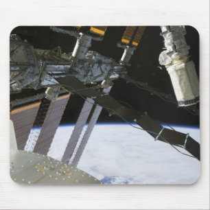 Endeavour's arm amidst International Space Stat Mouse Mat