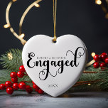 Engaged Personalise Engagement Gift For Christmas Ceramic Tree Decoration<br><div class="desc">Celebrate a momentous occasion with our Engaged Personalised Engagement Gift For Christmas Ceramic Ornament, designed to capture the beauty of your first Christmas together as an engaged couple. This ornament features an elegant, minimalist design in classic black and white, perfect for those who appreciate a clean and simple aesthetic. Whether...</div>