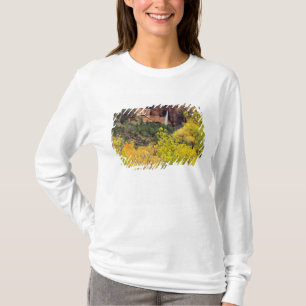 Ephemeral waterfall pours out of slot in cliff T-Shirt
