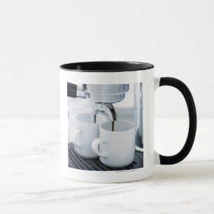 Espresso machine making coffee mug