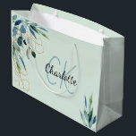 Eucalyptus greenery foliage monogram initials large gift bag<br><div class="desc">A light green background.  Decorated with watercolored eucalyptus and olive greenery,  and golden foliage. Personalise and add a name.  The name is written with a modern hand lettered style script.  
Perfect for gift wrapping or for party favours for birthdays,  bridal showers and baby showers.</div>