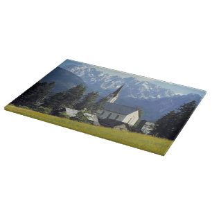 Europe, Austria, Gosau. The spire of the church Cutting Board