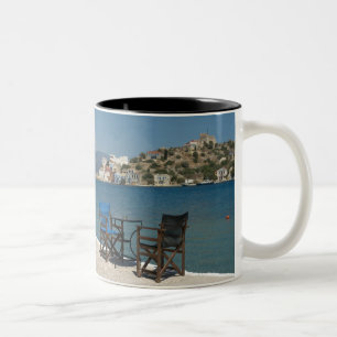 Europe, Greece, Kastellorizo: chairs on the edge Two-Tone Coffee Mug