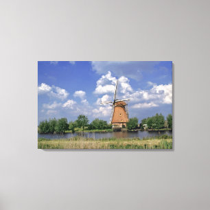Europe, Netherlands, Kinerdijk. A windmill sits Canvas Print