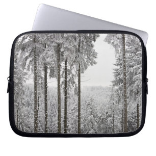 Evergreen forest in winter laptop sleeve