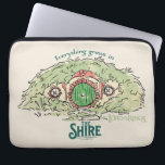 Everything Grows in THE SHIRE™ Laptop Sleeve<br><div class="desc">Bring a little piece of Middle-Earth™ to your everyday with this charming Lord of the Rings™ design inspired by the cozy hills of Hobbiton. Featuring a storybook-style hobbit hole with its iconic round green door tucked into a lush hillside, the artwork is paired with the beloved phrase, “Everything grows in...</div>