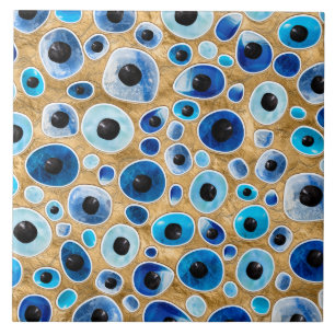 Evil Eye Pattern Tumbled Stones on gold Tile