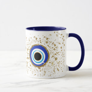 evil eye surrounded with gold mug