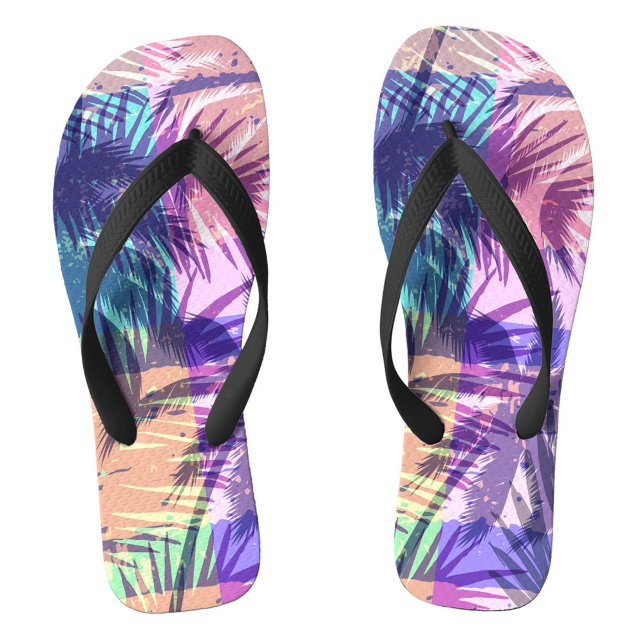 Exotic Flip Flops (A palm leaf patterns in vivid colors. The background reveals gentle waves lapping at the shore.  )