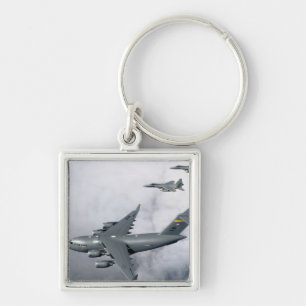 F-15B Eagles escort the first Hawaii-based C-17 Key Ring