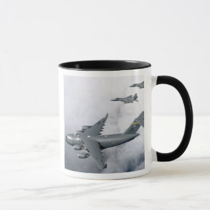 F-15B Eagles escort the first Hawaii-based C-17 Mug