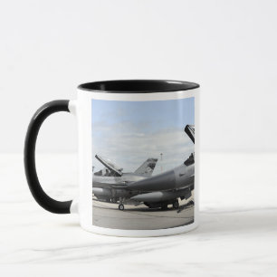 F-16 Fighting Falcons await to launch Mug