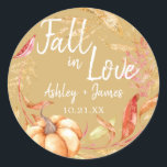 Fall in Love Autumn Leaf Yellow Wedding Monogram Classic Round Sticker<br><div class="desc">"Fall in Love" rustic themed wedding favour stickers feature orange and golden autumn foliage, a fall watercolor pumpkin and customisable monogram of the bride and groom's names and wedding date on an autumn leaf yellow background. Exclusively designed for you by Happy Dolphin Studio. If you need any help or matching...</div>