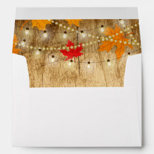 Fall wedding invite envelope wood, lights, leaves
