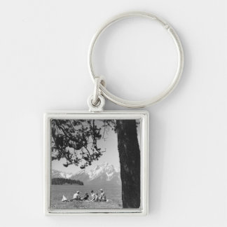 Family having picnic by lake mountains key ring