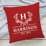 Family Name Monogram Laurel Year Established Red Cushion<br><div class="desc">Add a touch of elegance to your home decor with our personalized monogram family name throw pillow featuring a beautiful laurel design. The pillow is customized with your family name and a personalized year established text, making it a perfect addition to your living room or bedroom. Made with high-quality materials,...</div>