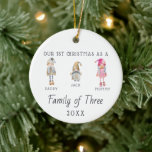 Family of Three | First Christmas Ornament<br><div class="desc">The perfect first Christmas keepsake for your family's first Christmas with your new baby. Our personalized Christmas ornaments feature charming watercolor Norwegian Christmas Gnome family, your family name and is also personalized with your photo on the back. Add your custom wording to this design by using the "Edit this design...</div>