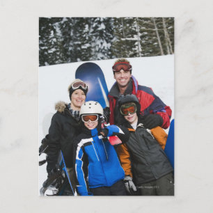 Family portrait with snowboards postcard