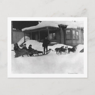 Family travelling by Dog Sled in Alaska Postcard