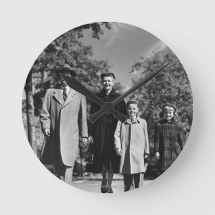 Family Walking Round Clock