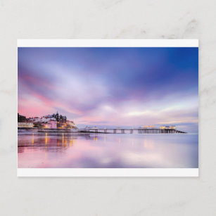 Famous Cromer pier in Norfolk England with pink su Postcard