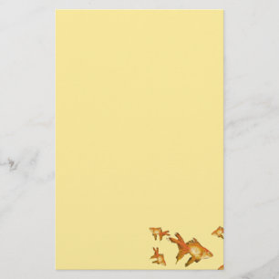 fancy gold goldfish swimming in aquarium stationery