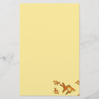 fancy gold goldfish swimming in aquarium stationery