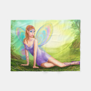 Fantasy fairy butterfly sits on grass in wood. fleece blanket