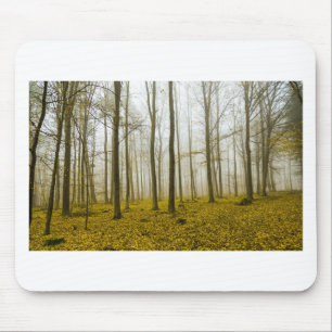 Fantasy forest with fog and yellow leaves mouse mat