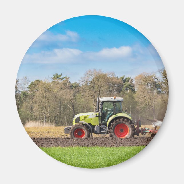 Farmer on tractor ploughing sandy soil in spring magnet (Front)