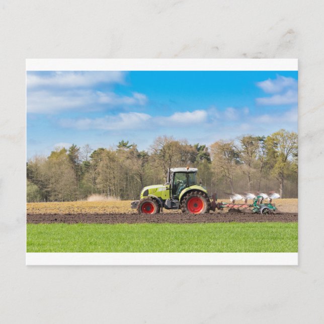 Farmer on tractor ploughing sandy soil in spring postcard (Front)