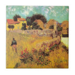 Farmhouse in Provence by Vincent van Gogh Tile<br><div class="desc">Farmhouse in Provence by Vincent van Gogh is a vintage fine art post impressionism architectural painting featuring a landscape with a farmer in the meadows and a gate leading to a farm in the south of France. About the artist: Vincent Willem van Gogh was a Post Impressionist painter whose work...</div>