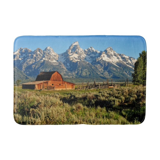 Farms | Barn Shadowed by Snow Capped Mountains Bath Mat (Front)